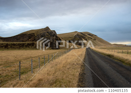 Gravel road and an autumn country, Iceland 110405135