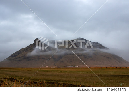 Autumn foggy country and a mountain, South Iceland 110405153