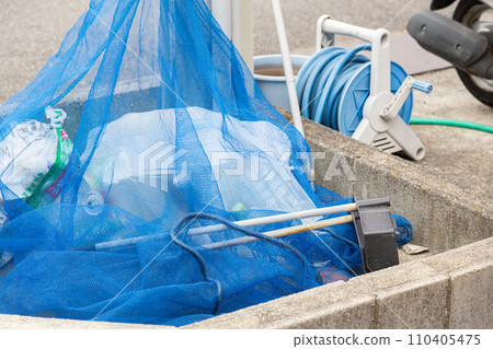 Garbage dump with a net to prevent crows Garbage dump with a net to prevent crows 110405475