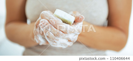 Closeup on young woman washing hands Closeup on young woman washing hands 110406644