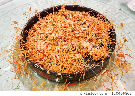 The food mess on table resulting from tossing and mixing yusheng during Chinese New Year meal is believed to bring luck and wealth 110406802