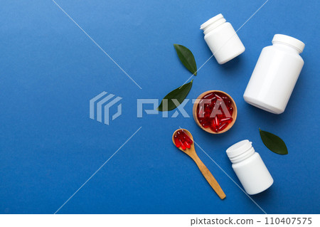 different drugs and health supplement pills with medicine bottle health care and medical top view. Vitamin tablets. Bottle with colored pills on table background. Multivitamins different drugs and health supplement pills with medicine bottle health care and medical top view. Vitamin tablets. Bottle with colored pills on table background. Multivitamins 110407575