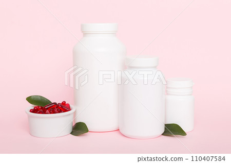 different drugs and health supplement pills with medicine bottle health care and medical top view. Vitamin tablets. Bottle with colored pills on table background. Multivitamins different drugs and health supplement pills with medicine bottle health care and medical top view. Vitamin tablets. Bottle with colored pills on table background. Multivitamins 110407584