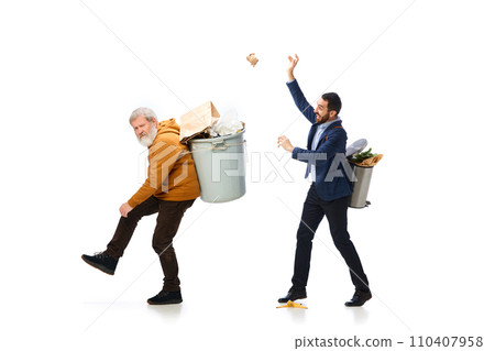 Sorting garbage types. Two men with trash bins on backs cleaning, taking care after planet, gathering garbage isolated over white background Sorting garbage types. Two men with trash bins on backs cleaning, taking care after planet, gathering garbage isolated over white background 110407958