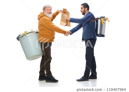 Senior and man in his 30s holding trash bins on backs, shaking hands, cleaning garbage isolated over white background 110407964