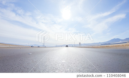 Embarking on a road trip from Nevada to California, driving on Highway 15 during the day offers scenic views and an exciting journey between states. 110408046
