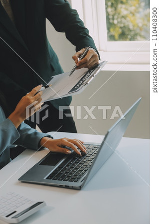 Closeup asian male people car salesman or sales manager offers to sell a car and explains and reads the terms of signing a car contract and insurance. 110408300