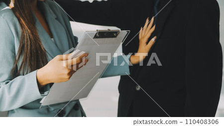 Sexsual harassment in workplace. Unhappy female employee looking at hand of boss touch at her shoulder and feeling disgusted. 110408306