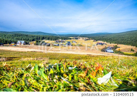 Jizerka village on sunny autumn day. Jizera Mountains, Czechia Jizerka village on sunny autumn day. Jizera Mountains, Czechia 110409515