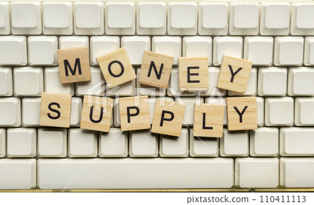 Closeup view row of wooden cubes with Money Supply letters 110411113