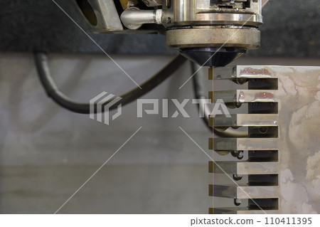 Closeup scene the wire EDM machine cutting the mold insert parts. 110411395