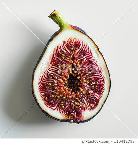 Half of a purple fig isolated on white background 110411792