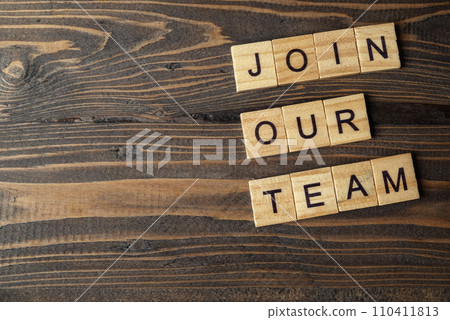Wooden cubes with Join Our Team letters on a wooden table Wooden cubes with Join Our Team letters on a wooden table 110411813