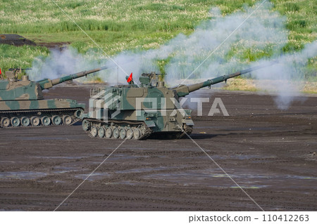 Ground Self-Defense Force self-propelled howitzer firing 110412263