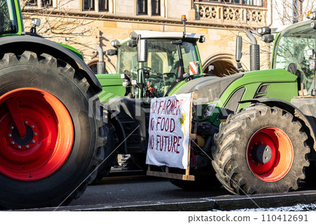 Farmers union protest strike against government Policy in Germany Europe. Tractors vehicles blocks city road traffic. Agriculture farm machines Magdeburg central Breiter weg street 110412691