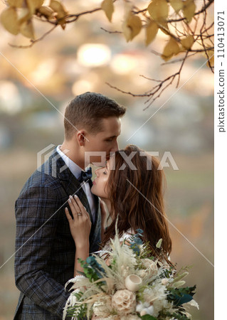 beautiful wedding couple together standing outdoor on natural background beautiful wedding couple together standing outdoor on natural background 110413071