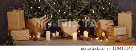 Banner cozy Christmas scene with wrapped gifts and candles 110413147