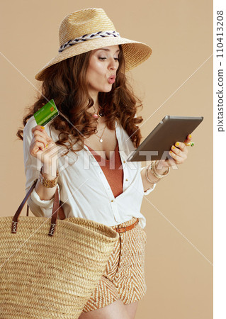 surprised elegant woman using digital tablet surprised elegant woman using digital tablet 110413208