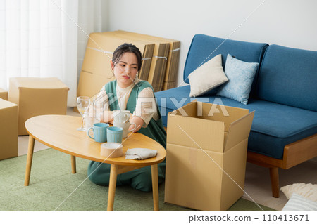 A woman preparing to move 110413671
