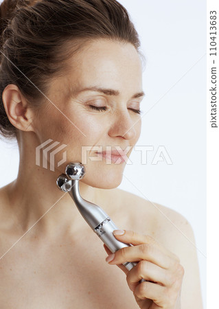 modern woman with massager on white 110413683