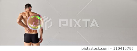 Rear view of muscular shirtless man in boxers, underwear, with soap bubble maximizing body part against grey background Rear view of muscular shirtless man in boxers, underwear, with soap bubble maximizing body part against grey background 110413795
