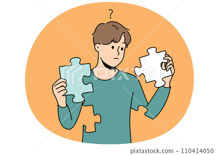 Confused man with puzzles in hands rebuild personality Confused man with puzzles in hands rebuild personality 110414050