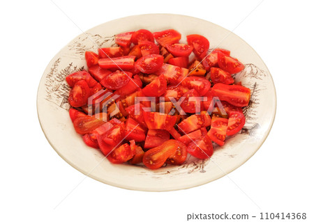 Tomatoes in a clay plate isolate on white background. Red sliced tomato in rustic beige bowl. Food making. Tomatoes in a clay plate isolate on white background. Red sliced tomato in rustic beige bowl. Food making. 110414368