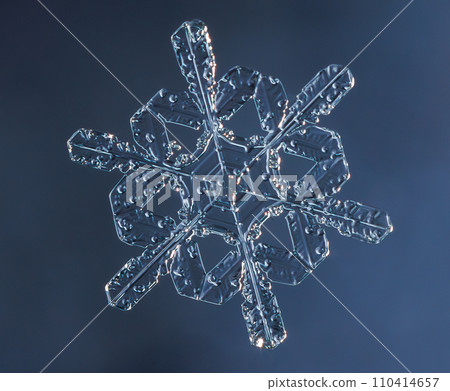 Natural snowflake crystal close-up macro photo 110414657