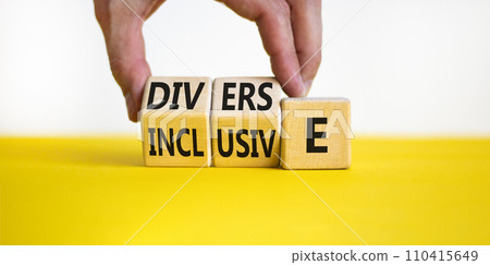 Diverse and inclusive symbol. Concept word Diverse and Inclusive on wooden cubes. Beautiful yellow table white background. Businessman hand. Business diverse and inclusive concept. Copy space. Diverse and inclusive symbol. Concept word Diverse and Inclusive on wooden cubes. Beautiful yellow table white background. Businessman hand. Business diverse and inclusive concept. Copy space. 110415649