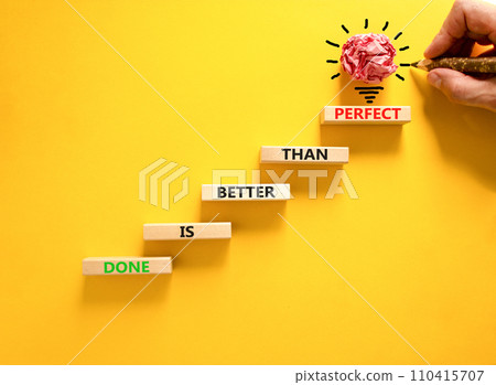 Done is better than perfect symbol. Concept words Done is better than perfect on wooden blocks. Beautiful yellow background. Businessman hand. Business done is better than perfect concept. Copy space. Done is better than perfect symbol. Concept words Done is better than perfect on wooden blocks. Beautiful yellow background. Businessman hand. Business done is better than perfect concept. Copy space. 110415707