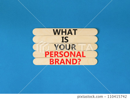 What is your personal brand symbol. Concept words What is your personal brand on wooden stick. Beautiful blue table blue background. Business, what is your personal brand concept. Copy space. 110415742