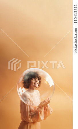 Woman inside a big soap bubble, introvert, loner, living in solitude, recluse. Mental health, psychology concept, inner world, shyness, hiding identity, dreaming, antisocial, alone, avoiding people 110415811