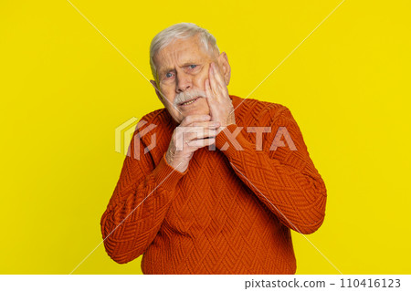 Senior old man touching cheek closing eyes with expression of terrible suffer from painful toothache 110416123