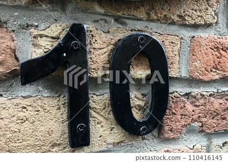 Close up of an house door number 10 Close up of an house door number 10 110416145