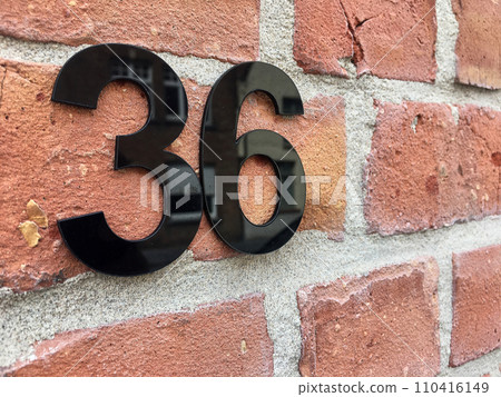 Close up of an house door number 36 Close up of an house door number 36 110416149