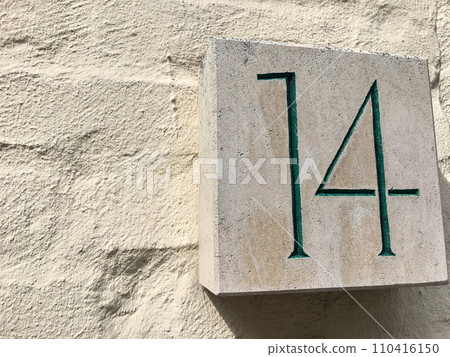 Close up of an house door number 14 110416150