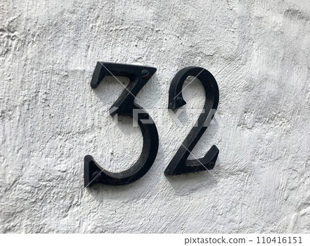 Close up of an house door number 32 110416151
