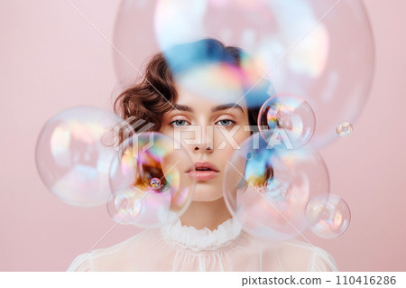 Beautiful young woman surrounded by soap bubbles. Concept of dreaming, thinking, worries and problems, lightheartedness. Mental health, psychology, inner world, shyness, alone 110416286