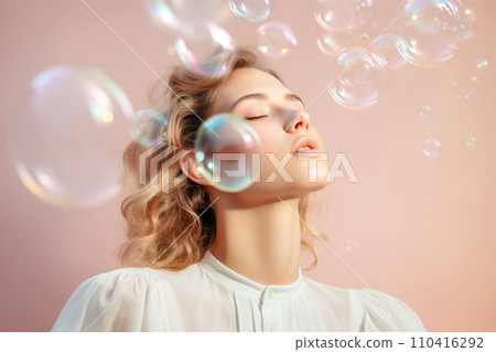 Beautiful young woman surrounded by soap bubbles. Concept of dreaming, thinking, worries and problems, lightheartedness. Mental health, psychology, inner world, shyness, alone 110416292