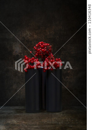 Still life with viburnum red in dark vases 110416348