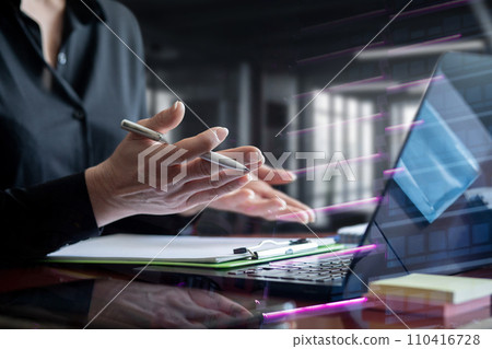 Businesswoman working online on the laptop in the office. 110416728