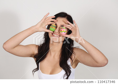 Beautiful woman with marzipan Easter eggs Beautiful woman with marzipan Easter eggs 110417346