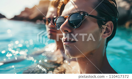 Gay couple relaxing in swimming pool. Gay couple relaxing in swimming pool. 110417372