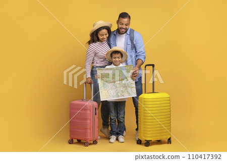 Happy Black Family With Little Son Looking At Map, Planning Travel Happy Black Family With Little Son Looking At Map, Planning Travel 110417392