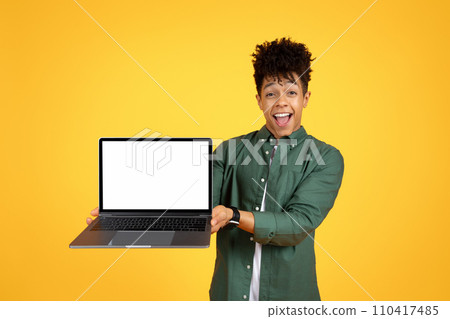 Cool african american young man holding laptop Cool african american young man holding laptop 110417485