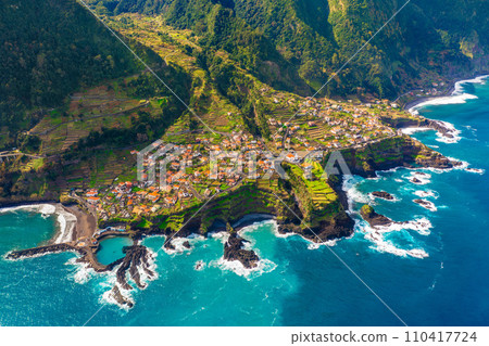 Aerial view of Madeira island. Land meets ocean in Seixal, Madeira, Portugal Aerial view of Madeira island. Land meets ocean in Seixal, Madeira, Portugal 110417724