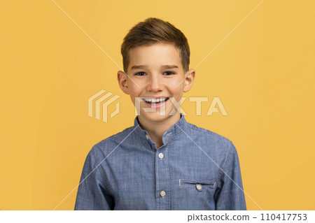 Handsome teen boy with happy smile looking at camera 110417753
