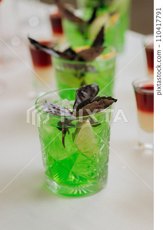 Welcome drink with cocktail glasses and drinks at an event. Alcoholic beverages at a wedding Welcome drink with cocktail glasses and drinks at an event. Alcoholic beverages at a wedding 110417791