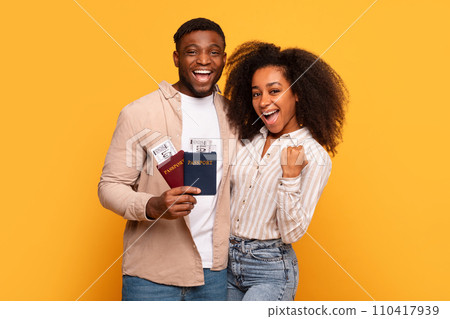 Joyful black couple with passports ready to travel Joyful black couple with passports ready to travel 110417939