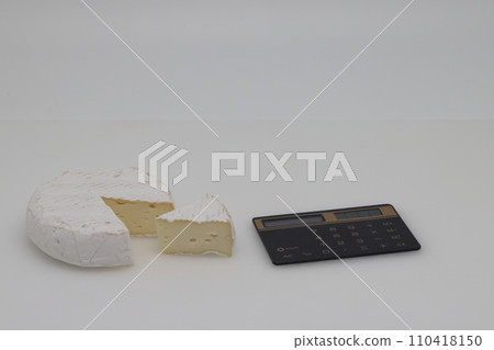 piece of cheese on a white background. Weight loss, diet and weight control. Still life with healthy food. Healthy food. The concept of a healthy lifestyle. Weight control. piece of cheese on a white background. Weight loss, diet and weight control. Still life with healthy food. Healthy food. The concept of a healthy lifestyle. Weight control. 110418150